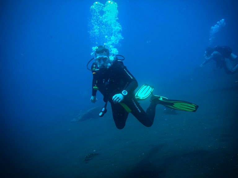 Underwater Parker, Rick Parker, diving in open blue water at Tulamben while completing his Open Water Course