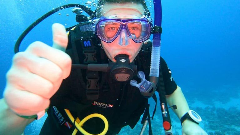 Underwater Parker (Rick Parker) signalling “let’s surface” during a dive.