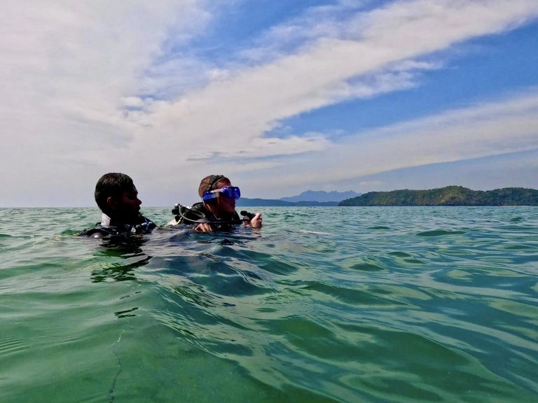 Scuba Diving at Langkawi, two divers at the surface, ready to submerge