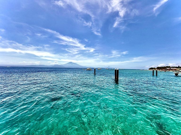 View from Nusa Penida pier with turquoise sea and Mount Agung in the background