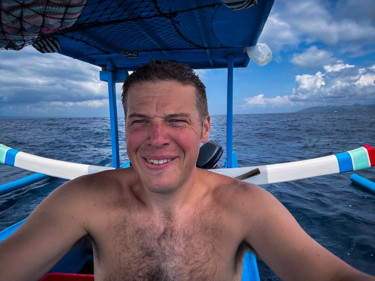 Rick Parker (Underwater Parker) on the boat heading out to a dive site in Candidasa, Bali.